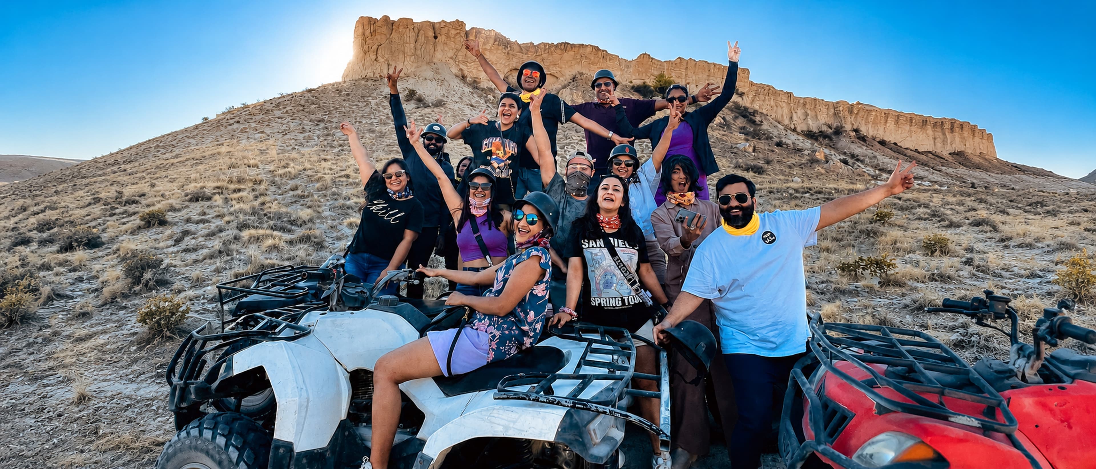 ExCo tribe celebrating on ATVs in the desert